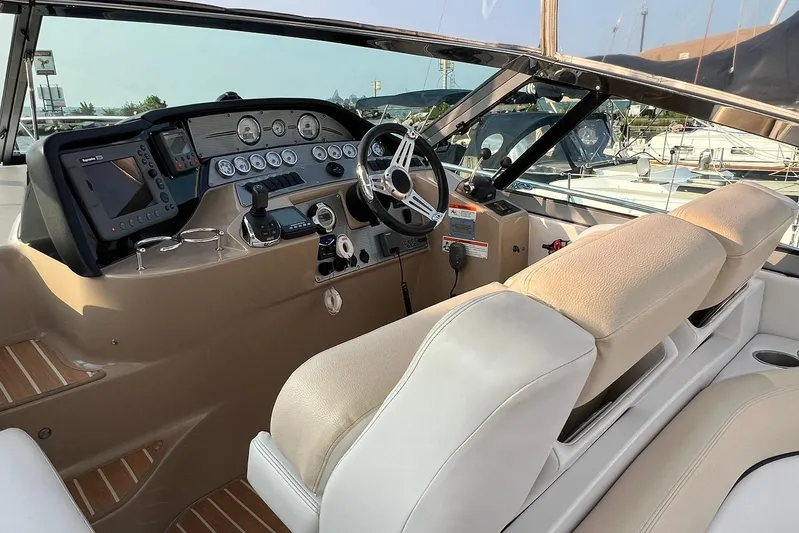  Yacht Photos Pics 2008 Four Winns 378 Vista boat cockpit with steering wheel and navigation controls.