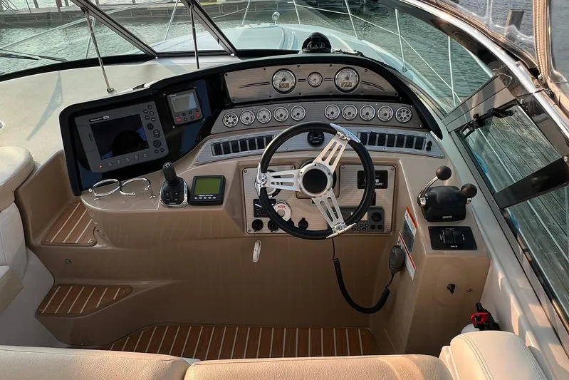  Yacht Photos Pics 2008 Four Winns 378 Vista boat cockpit with steering wheel and control panel.