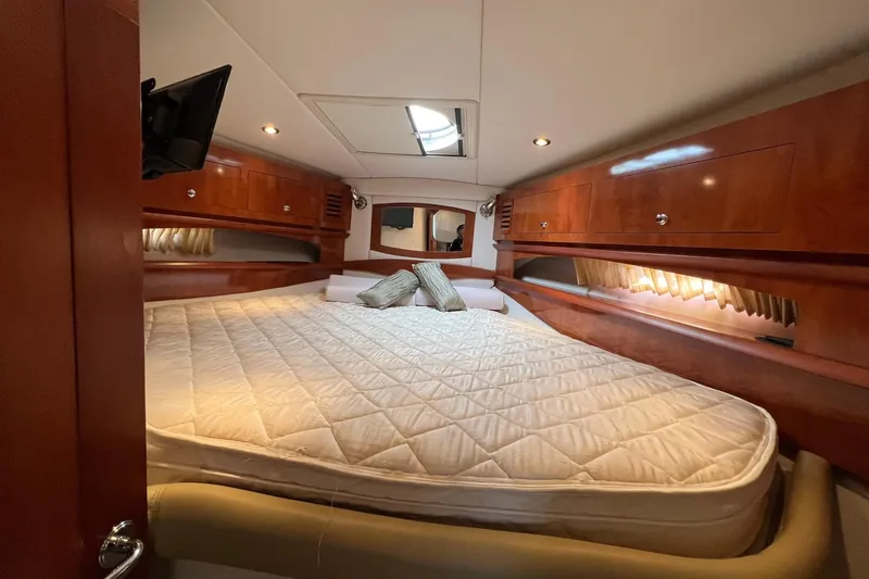  Yacht Photos Pics Luxurious cabin interior of 2008 Four Winns 378 Vista yacht with cozy bedding.