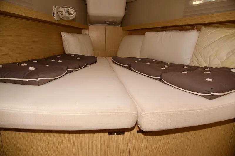  Yacht Photos Pics Cozy cabin interior of 2021 Hanse Dehler 38SQ yacht with comfortable bedding.