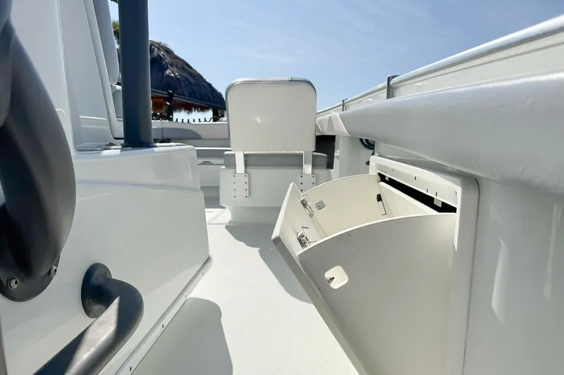  Yacht Photos Pics 2022 Yellowfin 26 Hybrid boat interior with open storage compartment.