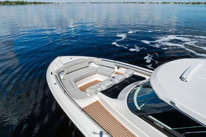 Moonrunner Yacht Photos Pics 2024 Tiara Yachts 48 LS luxury yacht on calm water, featuring spacious seating.