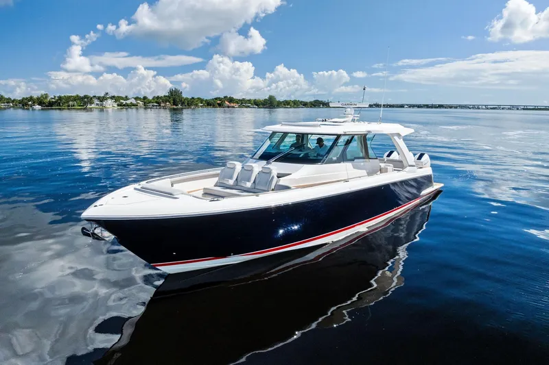 Moonrunner Yacht Photos Pics 2024 Tiara Yachts 48 LS luxury boat on calm water under blue sky.