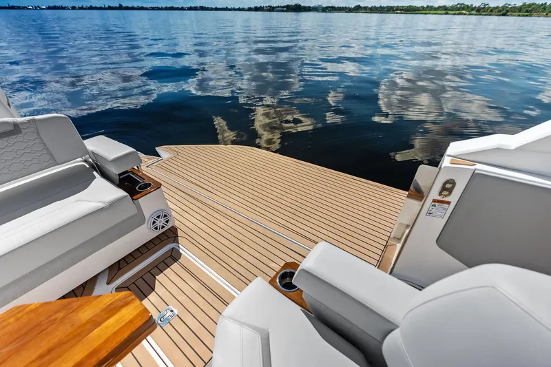 Moonrunner Yacht Photos Pics Luxurious 2024 Tiara Yachts 48 LS deck with elegant seating and serene water view.