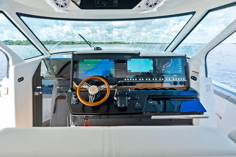 Moonrunner Yacht Photos Pics 2024 Tiara Yachts 48 LS helm with advanced navigation displays and luxurious interior.