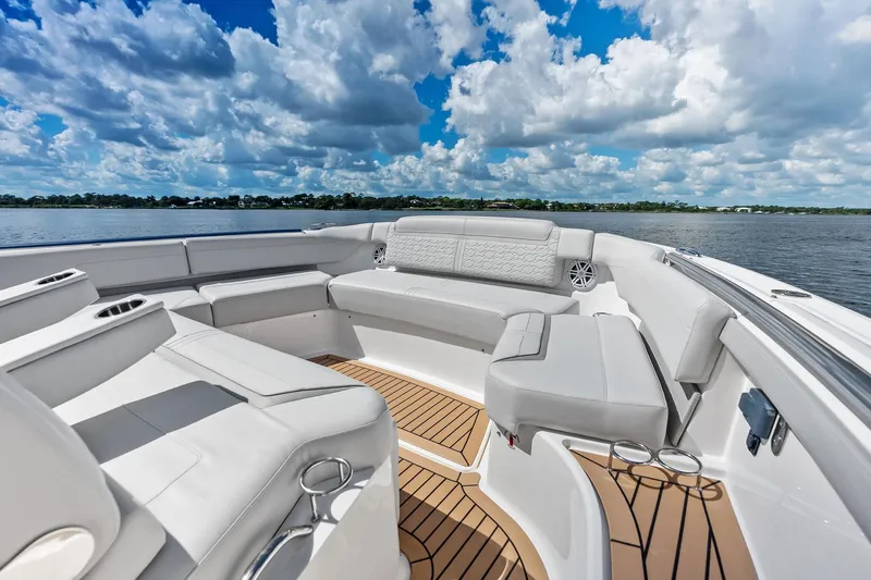 Moonrunner Yacht Photos Pics Luxurious seating area on 2024 Tiara Yachts 48 LS, with scenic water view.