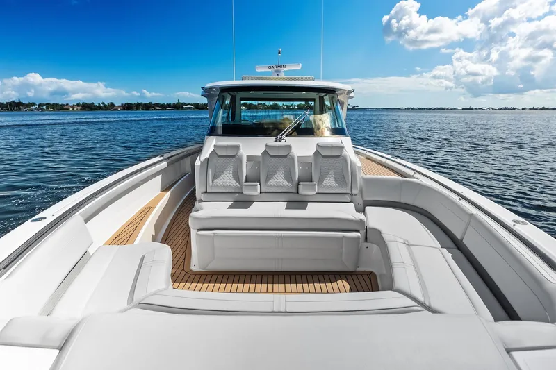 Moonrunner Yacht Photos Pics 2024 Tiara Yachts 48 LS luxury boat with spacious seating on open water.