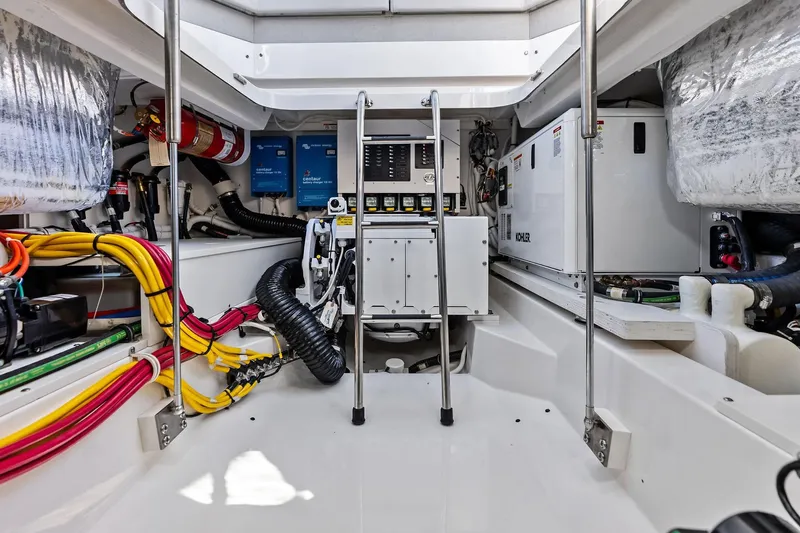 Moonrunner Yacht Photos Pics Engine room of 2024 Tiara Yachts 48 LS, featuring wiring and equipment.