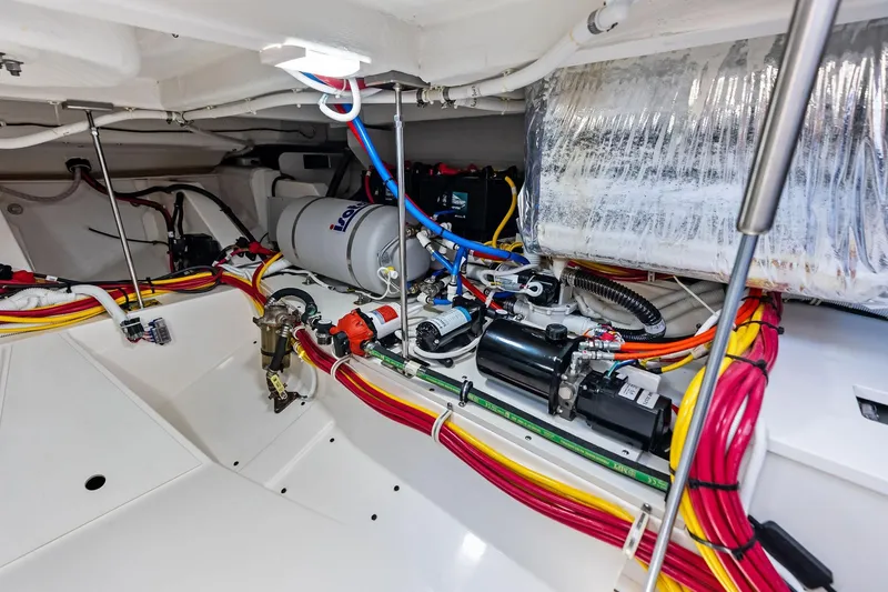 Moonrunner Yacht Photos Pics Engine room of 2024 Tiara Yachts 48 LS, showcasing wiring and mechanical components.
