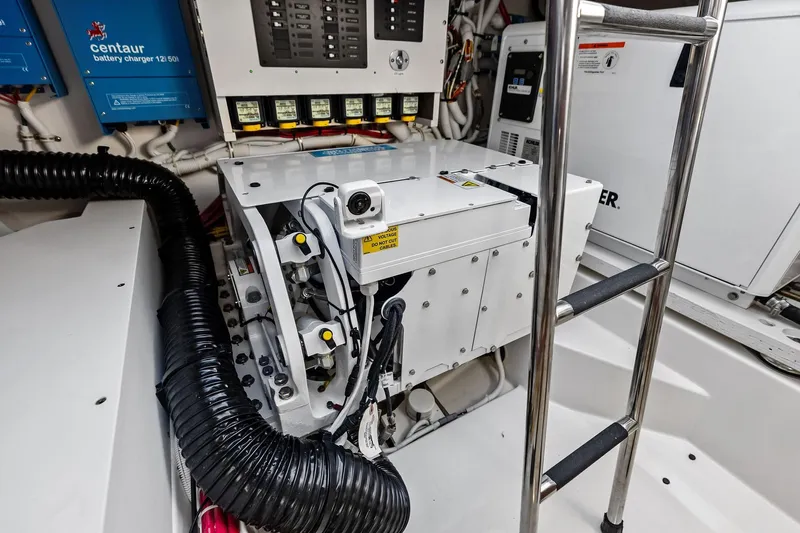 Moonrunner Yacht Photos Pics Engine room of 2024 Tiara Yachts 48 LS, featuring battery charger and equipment.