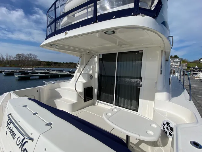  Yacht Photos Pics 2005 Sea Ray 420 Sedan Bridge yacht with spacious deck and sliding glass door.