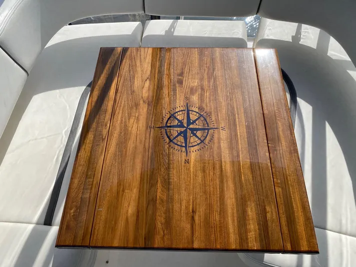  Yacht Photos Pics Wooden table with compass design on a 2005 Sea Ray 420 Sedan Bridge yacht.