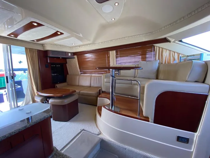  Yacht Photos Pics Luxurious interior of 2005 Sea Ray 420 Sedan Bridge yacht with elegant seating and wood accents.