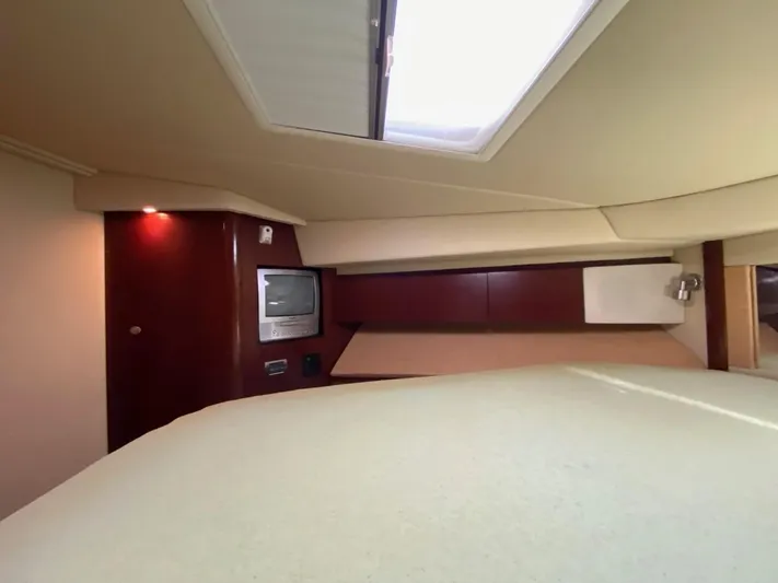  Yacht Photos Pics Interior cabin of 2005 Sea Ray 420 Sedan Bridge with TV and skylight.