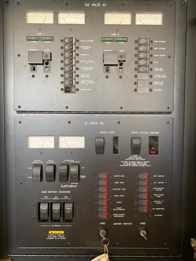  Yacht Photos Pics Electrical panel of a 2005 Sea Ray 420 Sedan Bridge boat, showing AC and DC controls.
