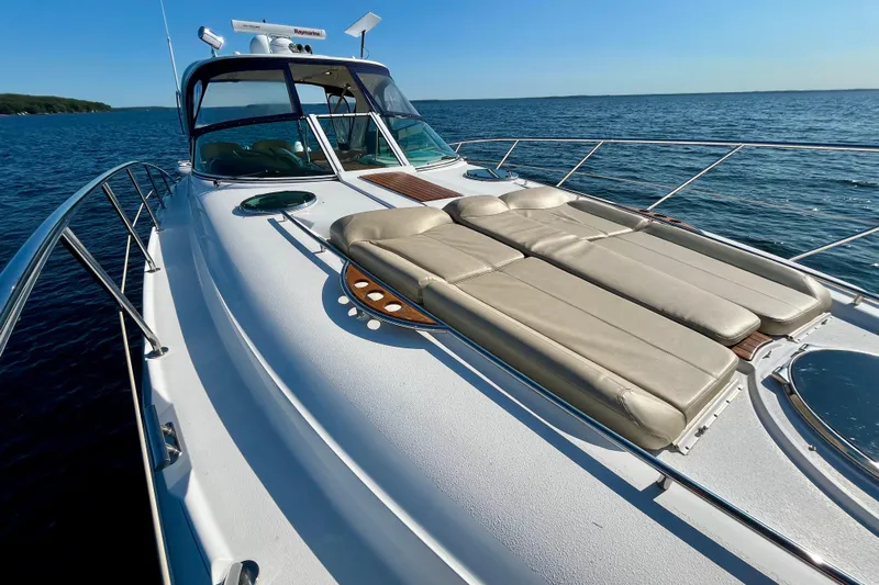 Outstanding Yacht Photos Pics 2007 Doral Alegria yacht with sun loungers on deck, cruising on open water.