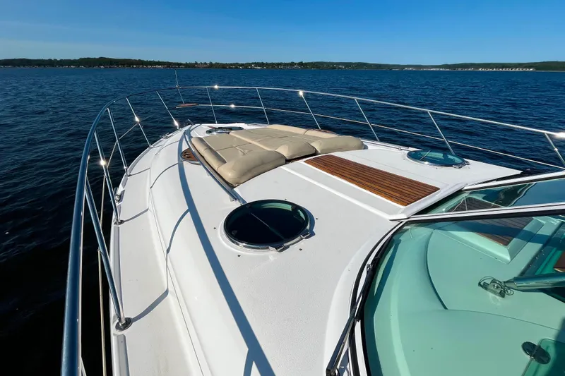 Outstanding Yacht Photos Pics 2007 Doral Alegria yacht deck with sun loungers on calm blue water.