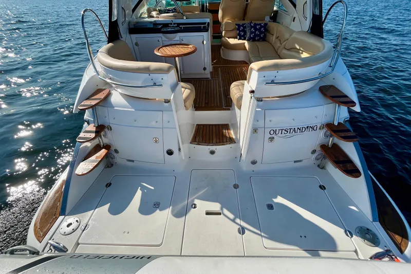 Outstanding Yacht Photos Pics 2007 Doral Alegria yacht with spacious deck and luxurious seating on calm water.