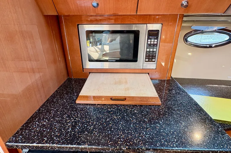 Outstanding Yacht Photos Pics Kitchen area in 2007 Doral Alegria boat with microwave and cutting board.