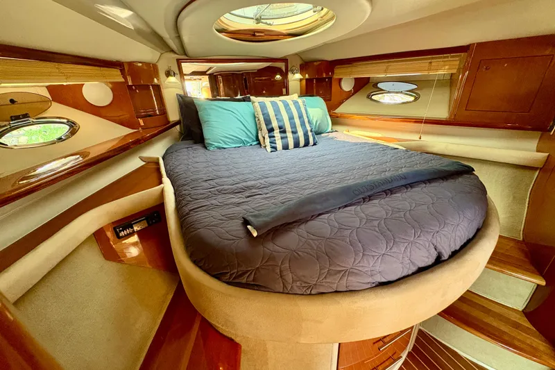 Outstanding Yacht Photos Pics Luxurious 2007 Doral Alegria yacht interior with cozy bed and elegant wood finishes.