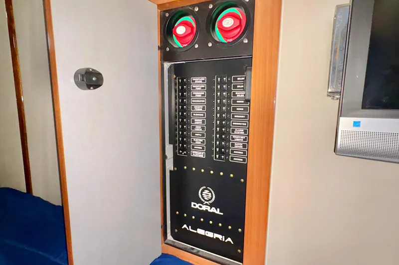 Outstanding Yacht Photos Pics Electrical panel inside 2007 Doral Alegria boat, featuring labeled switches and gauges.