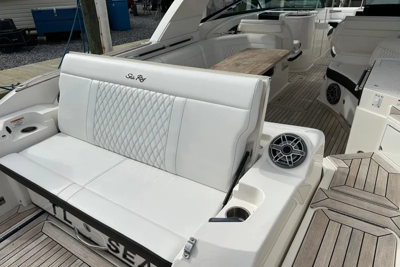  Yacht Photos Pics 2019 Sea Ray SLX 350 Outboard interior with white seating and wood accents.