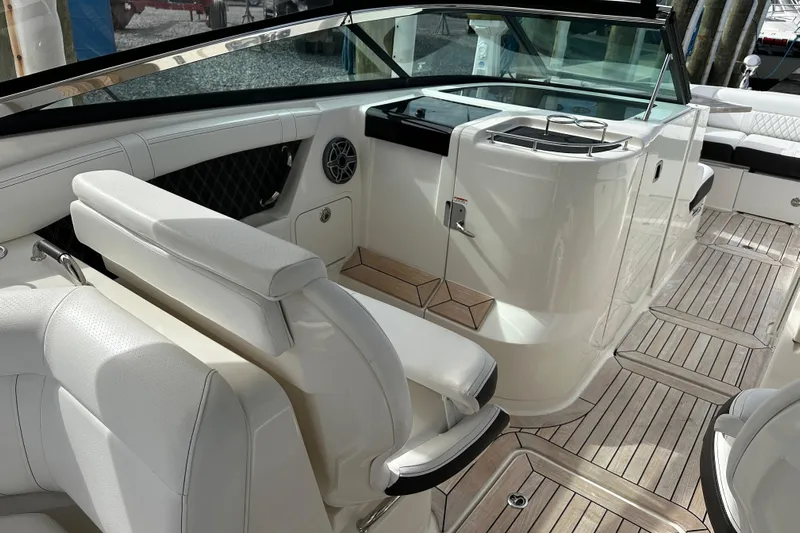  Yacht Photos Pics 2019 Sea Ray SLX 350 Outboard interior with white seating and wooden flooring.