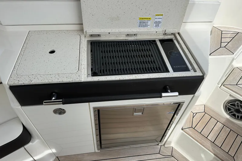  Yacht Photos Pics 2019 Sea Ray SLX 350 Outboard boat kitchen with Kenyon grill and storage.