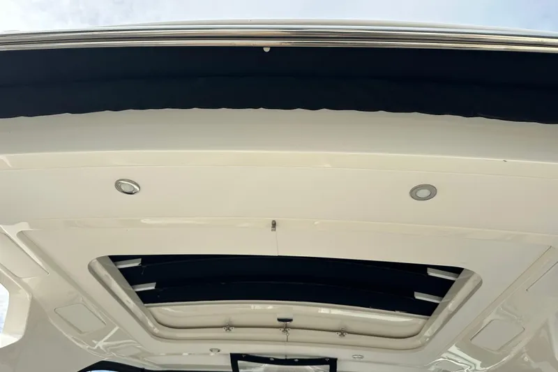  Yacht Photos Pics 2019 Sea Ray SLX 350 Outboard boat roof with recessed lighting and open sunroof.