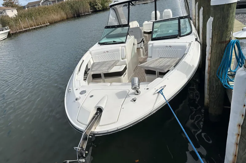  Yacht Photos Pics 2019 Sea Ray SLX 350 Outboard boat docked, featuring spacious seating and sleek design.