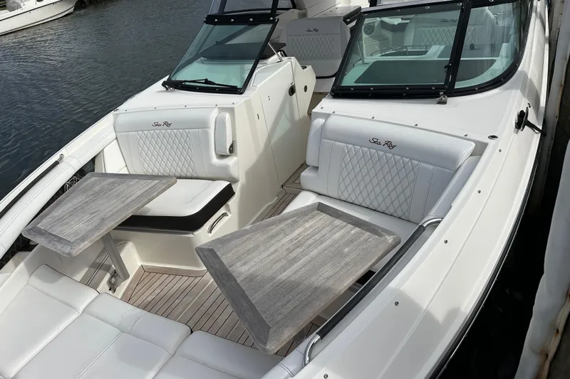  Yacht Photos Pics 2019 Sea Ray SLX 350 Outboard boat with elegant seating and wooden tables.