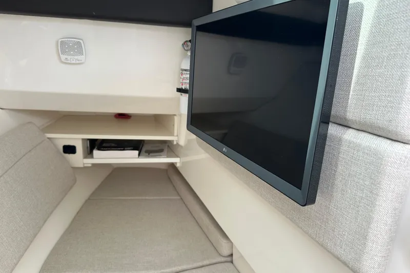 Yacht Photos Pics Interior of 2019 Sea Ray SLX 350 Outboard with TV and seating area.