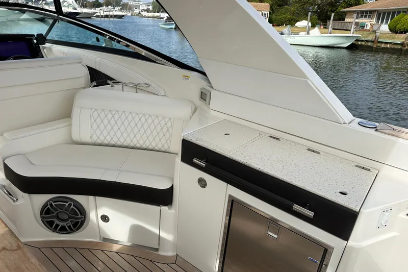  Yacht Photos Pics Luxurious interior of 2019 Sea Ray SLX 350 Outboard with seating and kitchenette.