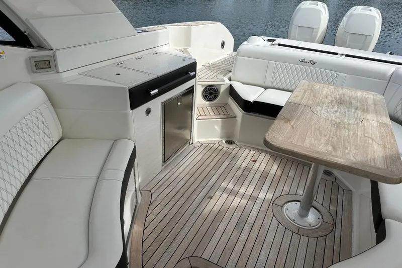  Yacht Photos Pics Luxurious 2019 Sea Ray SLX 350 Outboard interior with elegant seating and wooden table.