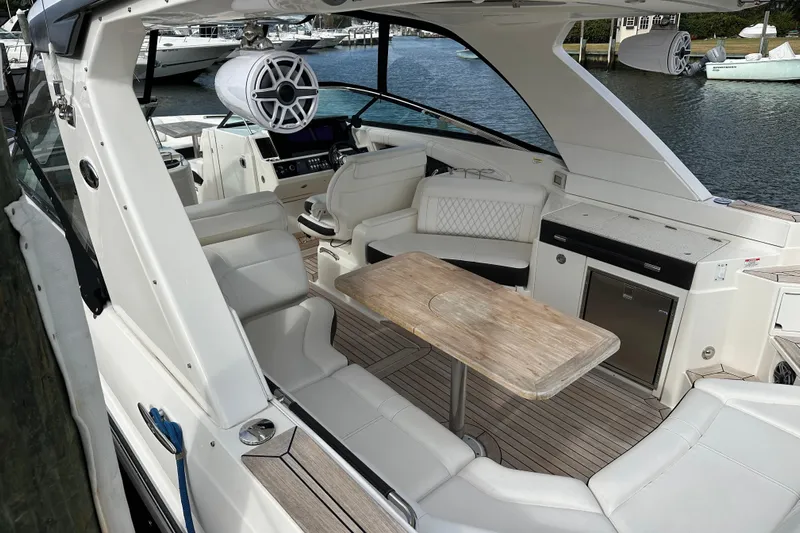  Yacht Photos Pics Luxurious 2019 Sea Ray SLX 350 Outboard boat interior with seating and table.