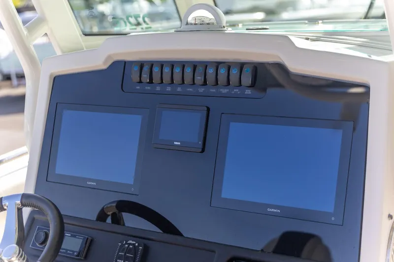  Yacht Photos Pics Dashboard of 2022 Sailfish 272 CC boat with Garmin displays and controls.