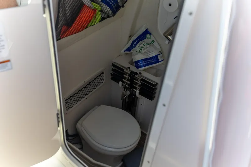  Yacht Photos Pics Interior of 2022 Sailfish 272 CC boat featuring compact marine toilet.