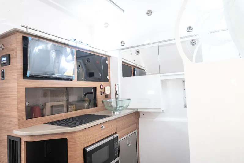More Life Yacht Photos Pics Interior of 2020 Everglades 435 Center Console boat with modern kitchen amenities.