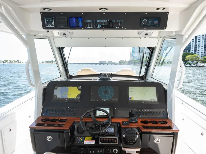 More Life Yacht Photos Pics 2020 Everglades 435 Center Console boat dashboard with navigation screens and controls.