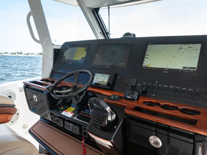 More Life Yacht Photos Pics 2020 Everglades 435 Center Console boat dashboard with navigation screens and controls.