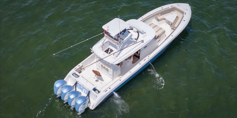 More Life Yacht Photos Pics 2020 Everglades 435 Center Console boat cruising on open water.