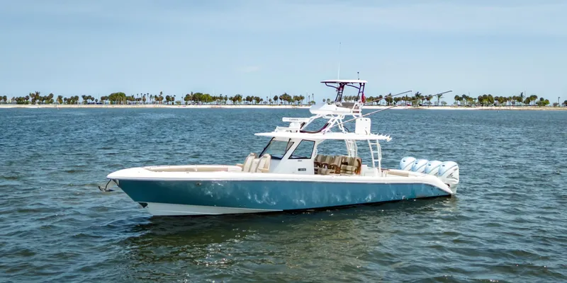 More Life Yacht Photos Pics 2020 Everglades 435 Center Console boat on open water, clear sky background.