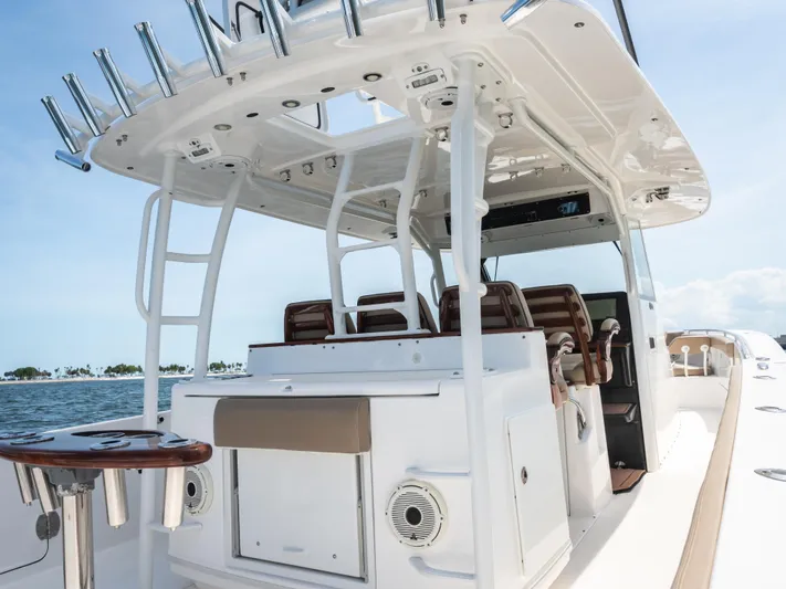 More Life Yacht Photos Pics 2020 Everglades 435 Center Console boat with seating and fishing rod holders.