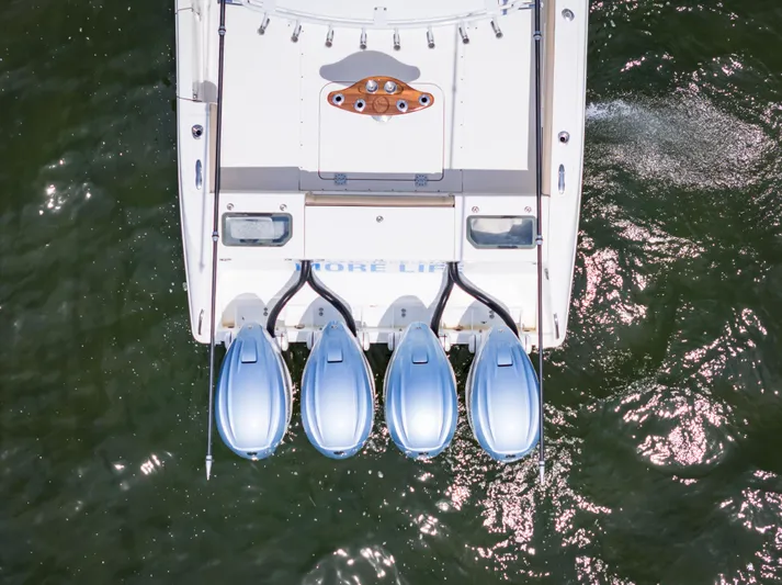 More Life Yacht Photos Pics Overhead view of 2020 Everglades 435 Center Console boat with four engines on water.
