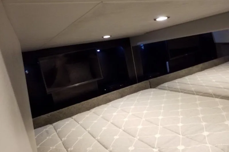  Yacht Photos Pics Interior cabin of 2021 Formula 350 Sun Sport with modern bedding and lighting.