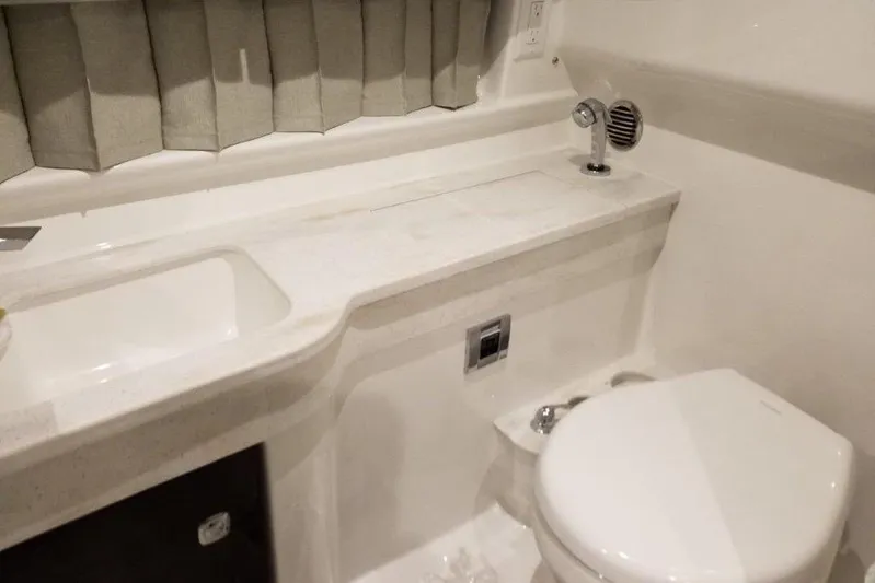  Yacht Photos Pics 2021 Formula 350 Sun Sport bathroom with sink, toilet, and modern fixtures.