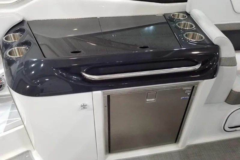  Yacht Photos Pics 2021 Formula 350 Sun Sport boat interior with sleek kitchenette and cup holders.