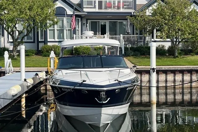  Yacht Photos Pics 2021 Formula 350 Sun Sport docked in front of a waterfront home.