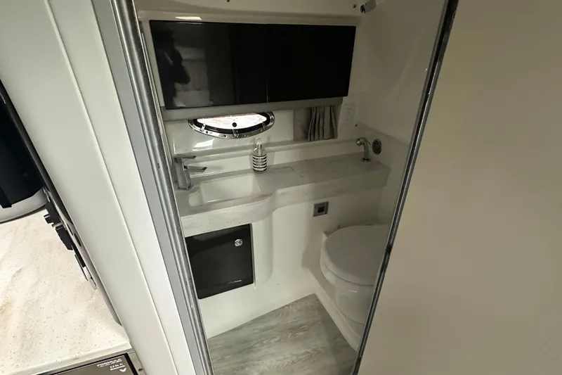  Yacht Photos Pics 2021 Formula 350 Sun Sport bathroom with modern sink, toilet, and storage.