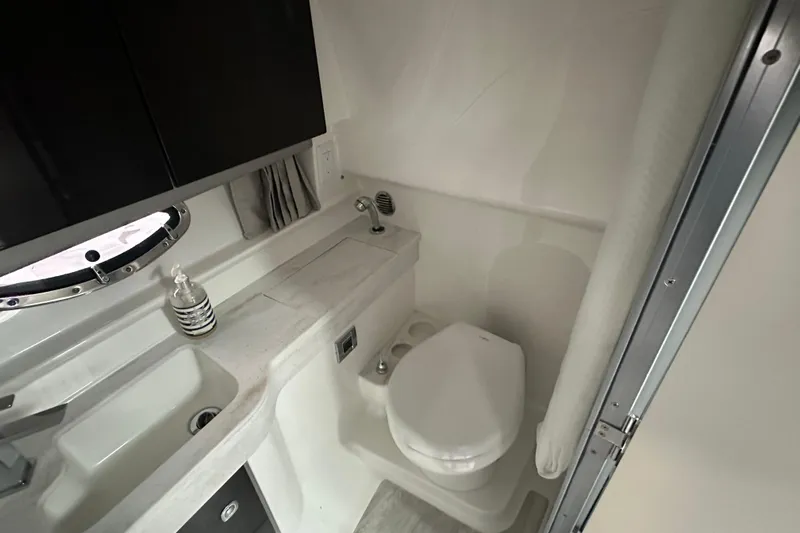  Yacht Photos Pics 2021 Formula 350 Sun Sport bathroom with modern fixtures and compact design.